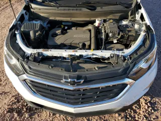 2020 Chevrolet Equinox LS z VIN 2GNAXHEV3L6149833, wystawiony jako Copart lot #57997985 z przebiegiem 64 304 mil mil oraz Szkoda całkowita • Salvage title. Historia ofert i sprzedaży dostępna na DreamBid. Obrazek 12.