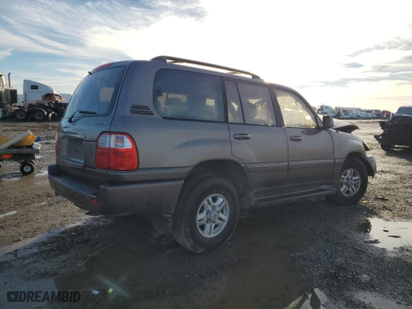 1999 Lexus LX 470 Luxury SUV with VIN JT6HT00W6X0067685, listed as a Copart auction lot 88894965 with 0 mi miles and Salvage Title. Bid and sale history available at carsss.com. Image 3.