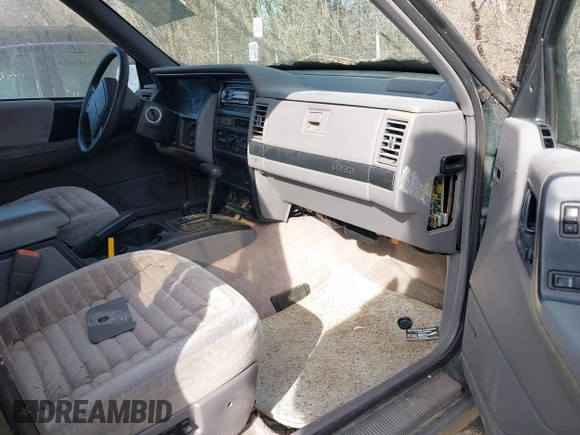 1993 Jeep Grand Cherokee Laredo with VIN 1J4GZ58S1PC680016, listed as a IAAI auction lot 41813392 with 149,520 mi miles. Bid and sale history available at carsss.com. Image 5.
