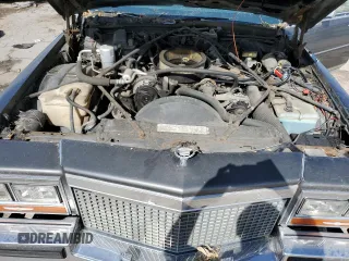 1988 Cadillac Brougham z VIN 1G6DW51Y2J9714052, wystawiony jako Copart lot #77274064 z przebiegiem 69 106 mil mil oraz Szkody całkowita. Historia ofert i sprzedaży dostępna na DreamBid. Obrazek 12.