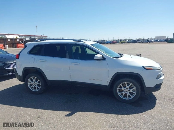 2014 Jeep Cherokee Latitude with VIN 1C4PJMCS4EW233979, listed as a IAAI auction lot 41976651 with 138,815 mi miles. Bid and sale history available at carsss.com. Image 13.