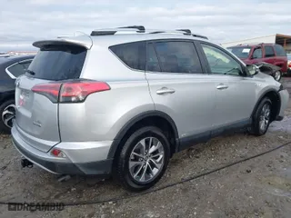 2016 Toyota RAV4 Hybrid XLE with VIN JTMRJREV3GD029654, listed as a IAAI auction lot 41144893 with 73,163 mi miles. Bid and sale history available at carsss.com. Image 4.