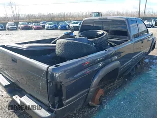 1999 Dodge Ram 2500 with VIN 3B7KF2367XG174415, listed as a IAAI auction lot 41662623 with 260,853 mi miles. Bid and sale history available at carsss.com. Image 4.