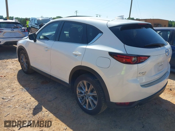 2021 Mazda CX-5 Grand Touring with VIN JM3KFBDM3M0493752, listed as a IAAI auction lot 42456854 with 35,122 mi miles and . Bid and sale history available at DreamBid. Image 3.