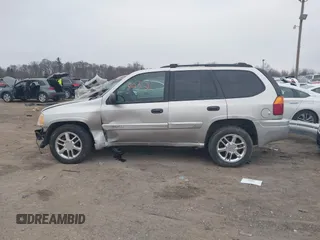 2004 GMC Envoy SLE with VIN 1GKDT13SX42135951, listed as a IAAI auction lot 41668252 with 216,193 mi miles. Bid and sale history available at carsss.com. Image 15.