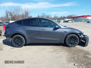 2023 Tesla Model Y Long Range with VIN 7SAYGDEE2PF883687, listed as a IAAI auction lot 41589837 with 36,890 mi miles. Bid and sale history available at carsss.com. Image 14.