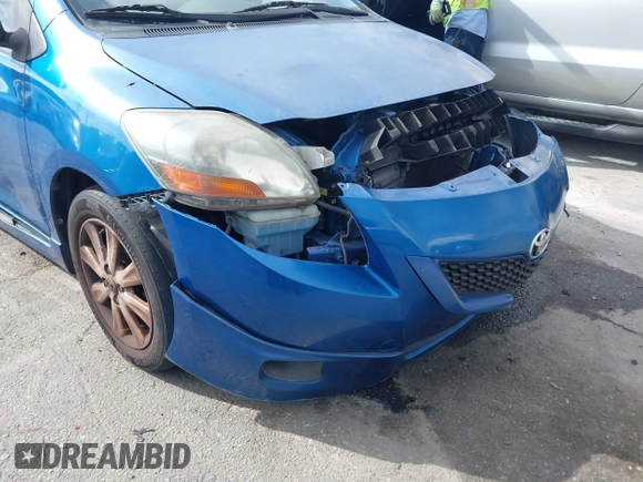 2009 Toyota Yaris with VIN JTDBT903591323255, listed as a IAAI auction lot 41933401 with 88,558 mi miles and . Bid and sale history available at DreamBid. Image 12.