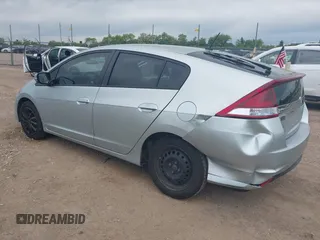 2012 Honda Insight LX with VIN JHMZE2H51CS002447, listed as a IAAI auction lot 42353583 with 179,377 mi miles and . Bid and sale history available at DreamBid. Image 3.