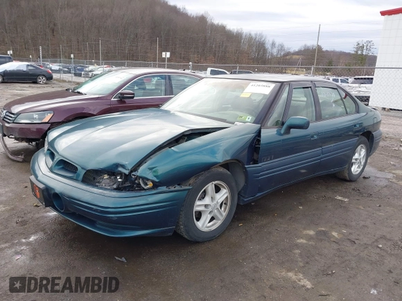 1996 Pontiac Bonneville z VIN 1G2HZ5210TH210829, wystawiony jako IAAI lot #41203888 z przebiegiem 154 990 mil mil oraz . Historia ofert i sprzedaży dostępna na DreamBid. Obrazek 2.