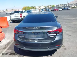 2014 Mazda Mazda6 i Touring with VIN JM1GJ1V52E1104111, listed as a IAAI auction lot 42008695 with 241,149 mi miles. Bid and sale history available at carsss.com. Image 6.