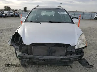 2009 Kia Rondo LX Base with VIN KNAFG528097222268, listed as a Copart auction lot 77797124 with 184,569 mi miles and Salvage Title. Bid and sale history available at carsss.com. Image 5.