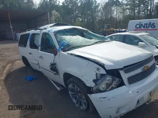 2013 Chevrolet Suburban LTZ with VIN 1GNSCKE05DR232994, listed as a IAAI auction lot 41470179 with 220,823 mi miles and . Bid and sale history available at DreamBid. Image 1.