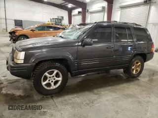 1998 Jeep Grand Cherokee Limited with VIN 1J4GZ88Z3WC165659, listed as a Copart auction lot 87527255 with 203,860 mi miles and Salvage Title. Bid and sale history available at carsss.com. Image 1.