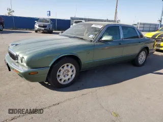 2000 Jaguar XJ with VIN SAJDA14C9YLF11827, listed as a Copart auction lot 70695314 with 267,459 mi miles and Salvage Title. Bid and sale history available at DreamBid. Image 1.