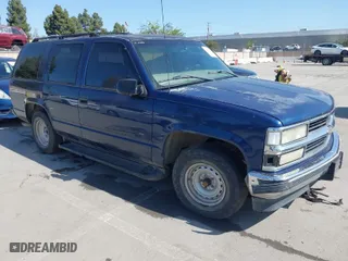 1999 Chevrolet Tahoe with VIN 1GNEC13R7XJ573387, listed as a IAAI auction lot 42001191 with 241,007 mi miles. Bid and sale history available at carsss.com. Image 1.
