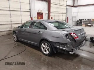2013 Ford Taurus SEL with VIN 1FAHP2E86DG177504, listed as a IAAI auction lot 42071852 with 130,547 mi miles and . Bid and sale history available at carsss.com. Image 3.