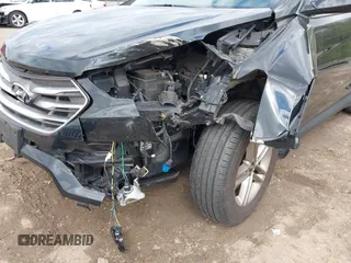 2018 Hyundai Santa Fe 2.4L z VIN 5NMZUDLB2JH058032, wystawiony jako IAAI lot #42206116 z przebiegiem 138 688 mil mil oraz . Historia ofert i sprzedaży dostępna na DreamBid. Obrazek 6.