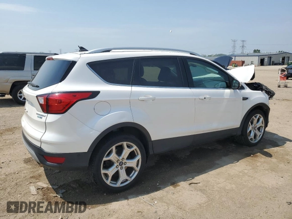 2019 Ford Escape Titanium z VIN 1FMCU9J93KUA51020, wystawiony jako Copart lot #60462495 z przebiegiem 59 998 mil mil oraz Szkoda całkowita • Salvage title. Historia ofert i sprzedaży dostępna na DreamBid. Obrazek 3.