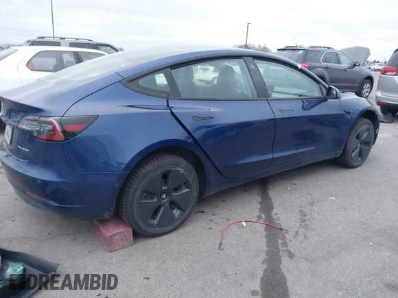 2021 Tesla Model 3 Long Range with VIN 5YJ3E1EB8MF848049, listed as a IAAI auction lot 40974331 with 61,462 mi miles. Bid and sale history available at carsss.com. Image 4.
