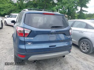 2018 Ford Escape Titanium with VIN 1FMCU0J99JUA12717, listed as a IAAI auction lot 42237509 with 123,896 mi miles and . Bid and sale history available at DreamBid. Image 16.