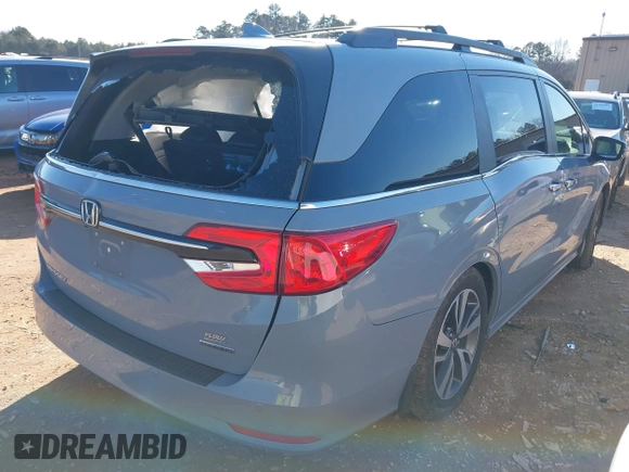 2023 Honda Odyssey Touring with VIN 5FNRL6H84PB005208, listed as a IAAI auction lot 41374452 with 60,288 mi miles and . Bid and sale history available at DreamBid. Image 4.