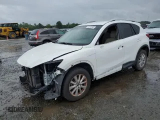 2016 Mazda CX-5 Touring z VIN JM3KE2CY5G0849288, wystawiony jako Copart lot #54594545 z przebiegiem 90 882 mil mil oraz Szkody całkowita. Historia ofert i sprzedaży dostępna na DreamBid. Obrazek 1.