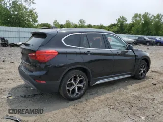 2018 BMW X1 xDrive28i with VIN WBXHT3C36J3H29952, listed as a Copart auction lot 59679285 with 75,220 mi miles and Salvage title. Bid and sale history available at DreamBid. Image 3.