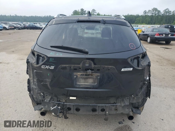 2016 Mazda CX-5 Grand Touring z VIN JM3KE2DY5G0676290, wystawiony jako Copart lot #54155325 z przebiegiem 124 743 mil mil oraz Szkoda całkowita • Salvage title. Historia ofert i sprzedaży dostępna na DreamBid. Obrazek 6.