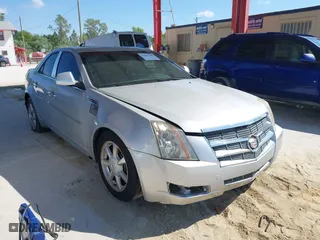2009 Cadillac CTS AWD w/1SB with VIN 1G6DS57V190159989, listed as a IAAI auction lot 41897485 with 115,439 mi miles. Bid and sale history available at carsss.com. Image 1.