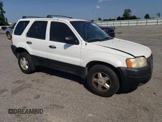 2004 Ford Escape XLS with VIN 1FMYU021X4DA07352, listed as a Copart auction lot 68909864 with 275,776 mi miles and Salvage Title. Bid and sale history available at carsss.com. Image 4.