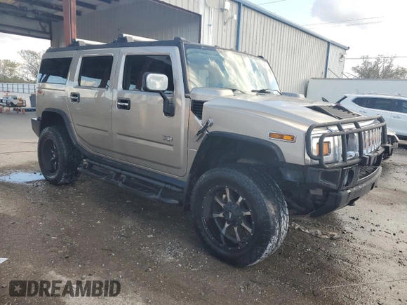 2003 Hummer H2 with VIN 5GRGN23U13H147071, listed as a Copart auction lot 82255674 with 272,215 mi miles and Salvage Title. Bid and sale history available at carsss.com. Image 4.