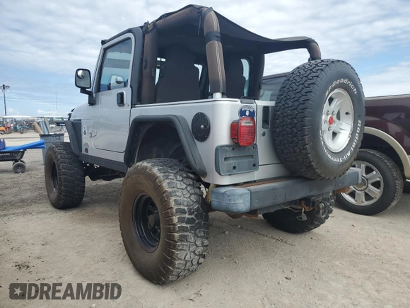 2003 Jeep Wrangler Rubicon z VIN 1J4FA69S53P340085, wystawiony jako Copart lot #74564574 z przebiegiem Nie podano mil oraz Szkoda całkowita • Salvage title. Historia ofert i sprzedaży dostępna na DreamBid. Obrazek 2.