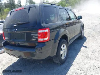 2011 Ford Escape XLT with VIN 1FMCU9DG5BKC36529, listed as a IAAI auction lot 42045682 with 141,101 mi miles. Bid and sale history available at carsss.com. Image 4.