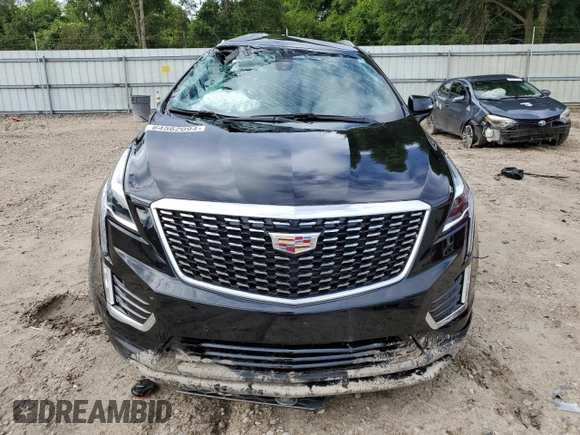 2023 Cadillac XT5 FWD Luxury z VIN 1GYKNAR40PZ106096, wystawiony jako Copart lot #80909074 z przebiegiem 19 677 mil mil oraz Nie do naprawy • Non repairable. Historia ofert i sprzedaży dostępna na DreamBid. Obrazek 5.