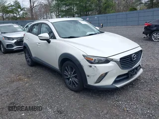 2018 Mazda CX-3 Touring with VIN JM1DKFC71J0315074, listed as a IAAI auction lot 42029790 with 100,268 mi miles. Bid and sale history available at carsss.com. Image 1.