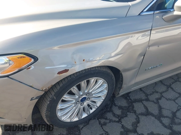2015 Ford Fusion SE Hybrid with VIN 3FA6P0LUXFR133979, listed as a IAAI auction lot 41831288 with 143,738 mi miles. Bid and sale history available at carsss.com. Image 6.