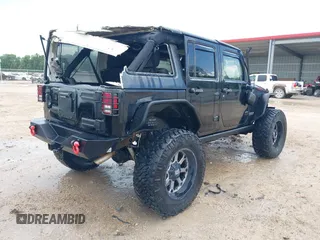 2015 Jeep Wrangler Unlimited Rubicon Hard Rock with VIN 1C4HJWFG0FL674700, listed as a IAAI auction lot 42511949 with 138,370 mi miles and . Bid and sale history available at DreamBid. Image 4.