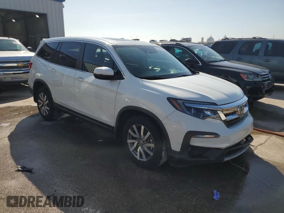 2021 Honda Pilot EX-L with VIN 5FNYF5H54MB045464, listed as a Copart auction lot 63412425 with 60,666 mi miles and Salvage title. Bid and sale history available at DreamBid. Image 4.
