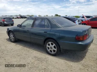 1996 Toyota Camry LE with VIN 4T1BF12K5TU861825, listed as a Copart auction lot 59803174 with 217,650 mi miles and Salvage title. Bid and sale history available at DreamBid. Image 2.