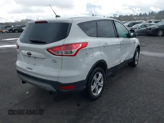 2013 Ford Escape SE with VIN 1FMCU9G93DUA17816, listed as a IAAI auction lot 41688140 with 129,738 mi miles. Bid and sale history available at carsss.com. Image 4.