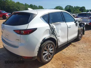 2021 Mazda CX-5 Grand Touring with VIN JM3KFBDM3M0493752, listed as a IAAI auction lot 42456854 with 35,122 mi miles and . Bid and sale history available at DreamBid. Image 4.