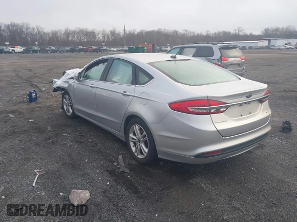 2018 Ford Fusion SE z VIN 3FA6P0HD2JR207865, wystawiony jako IAAI lot #41835895 z przebiegiem 91 069 mil mil oraz . Historia ofert i sprzedaży dostępna na DreamBid. Obrazek 3.