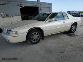2001 Cadillac Eldorado Touring ETC with VIN 1G6ET12921B104402, listed as a Copart auction lot 52319595 with 82,946 mi miles and Salvage Title. Bid and sale history available at carsss.com. Image 1.