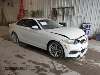2016 BMW 2 Series 228i xDrive with VIN WBA1G9C53GVX97088, listed as a IAAI auction lot 41617710 with 72,978 mi miles. Bid and sale history available at carsss.com. Image 1.