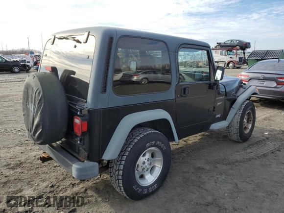2002 Jeep Wrangler Sport with VIN 1J4FA49S32P758082, listed as a Copart auction lot 80692073 with 148,784 mi miles and Salvage Title. Bid and sale history available at carsss.com. Image 3.