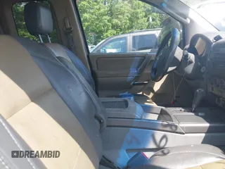 2004 Nissan Titan SE with VIN 1N6AA06A94N545539, listed as a IAAI auction lot 42036468 with 212,269 mi miles. Bid and sale history available at carsss.com. Image 5.