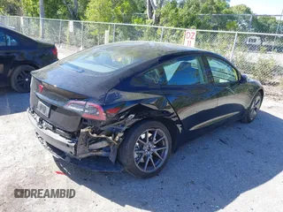 2023 Tesla Model 3 with VIN 5YJ3E1EAXPF623403, listed as a IAAI auction lot 41829543 with 29,414 mi miles and . Bid and sale history available at carsss.com. Image 4.