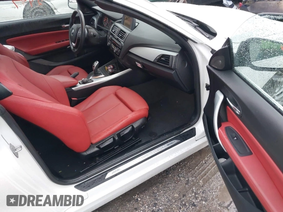 2016 BMW 2 Series 228i xDrive with VIN WBA1L9C59GV767802, listed as a IAAI auction lot 41132997 with 87,674 mi miles. Bid and sale history available at carsss.com. Image 5.