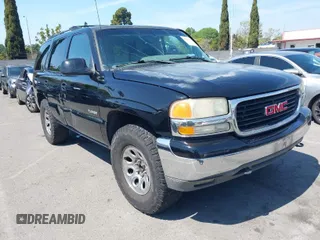 2002 GMC Yukon SLT with VIN 1GKEC13T92R162978, listed as a IAAI auction lot 41851599 with 213,789 mi miles. Bid and sale history available at carsss.com. Image 1.