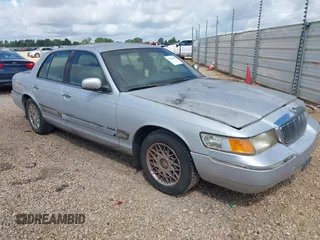 2002 Mercury Grand Marquis GS z VIN 2MEFM74W92X607734, wystawiony jako IAAI lot #42413400 z przebiegiem 209 565 mil mil oraz . Historia ofert i sprzedaży dostępna na DreamBid. Obrazek 1.